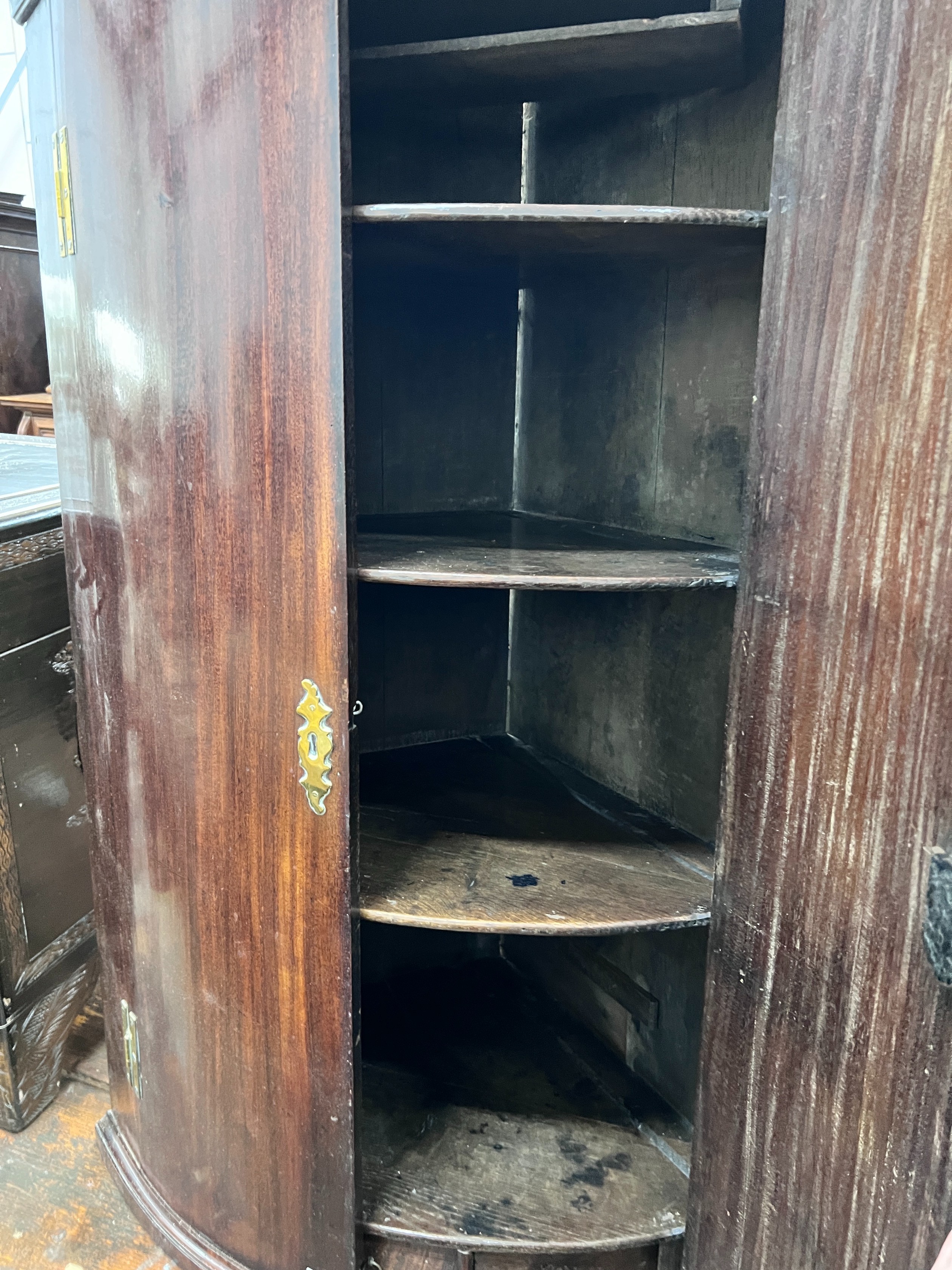 A George III mahogany bowfront hanging corner cabinet, width 73cm, depth 51cm, height 114cm *Please note the sale commences at 9am.